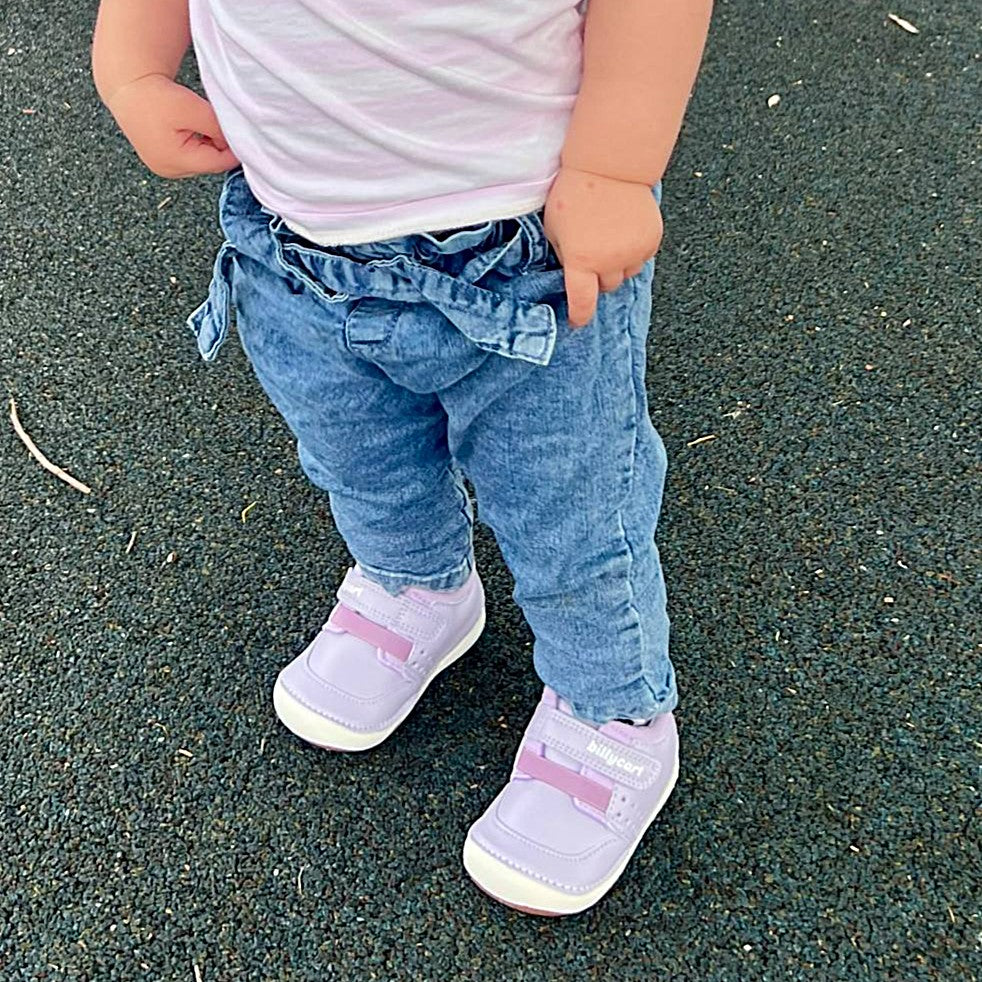 Billycart Kids Sophia Purple First Walker Sneakers for Girls with soft innersoles worn outdoors.