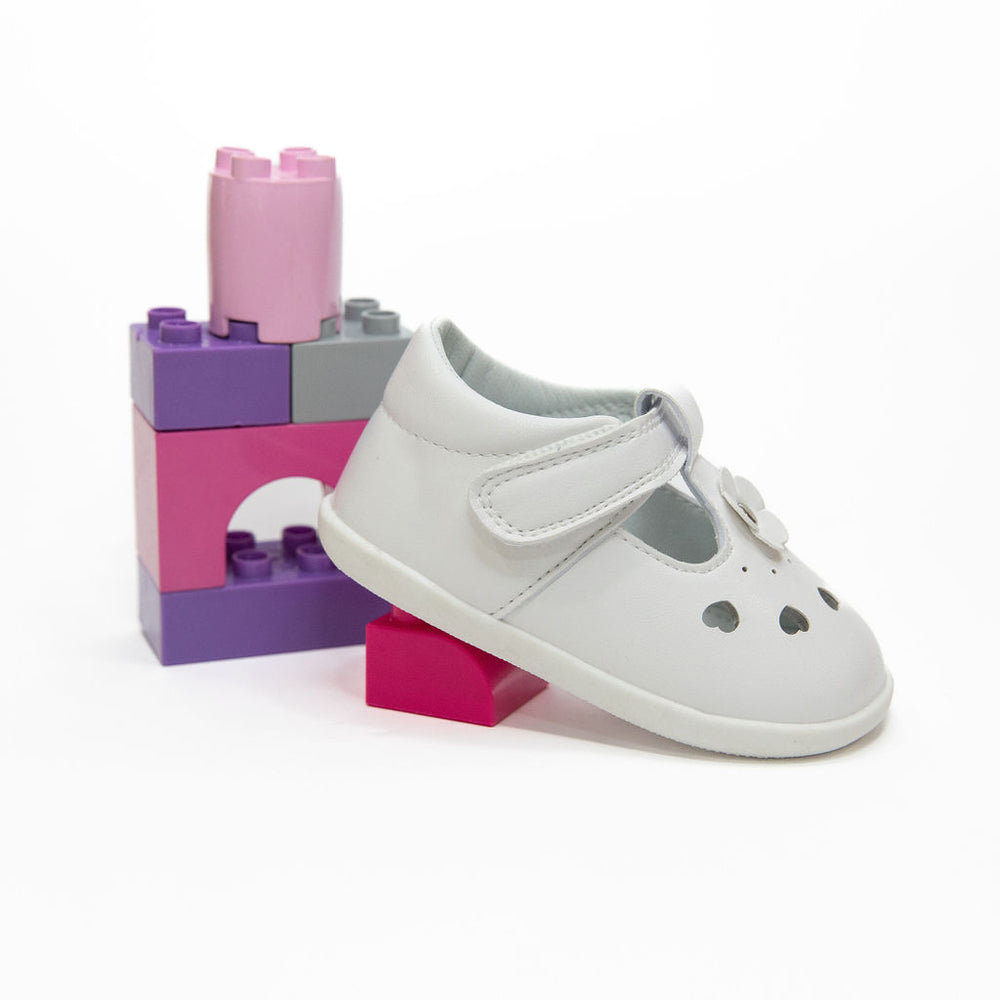 A toddler wearing Billycart Kids Lily Pink Stylish prewalker soft sole White Tbar sneakers