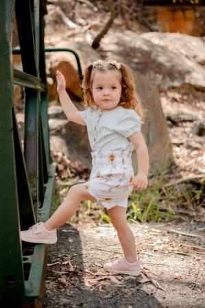 A little girl wearing Billycart Kids Pink Audrey soft sole sneakers for children